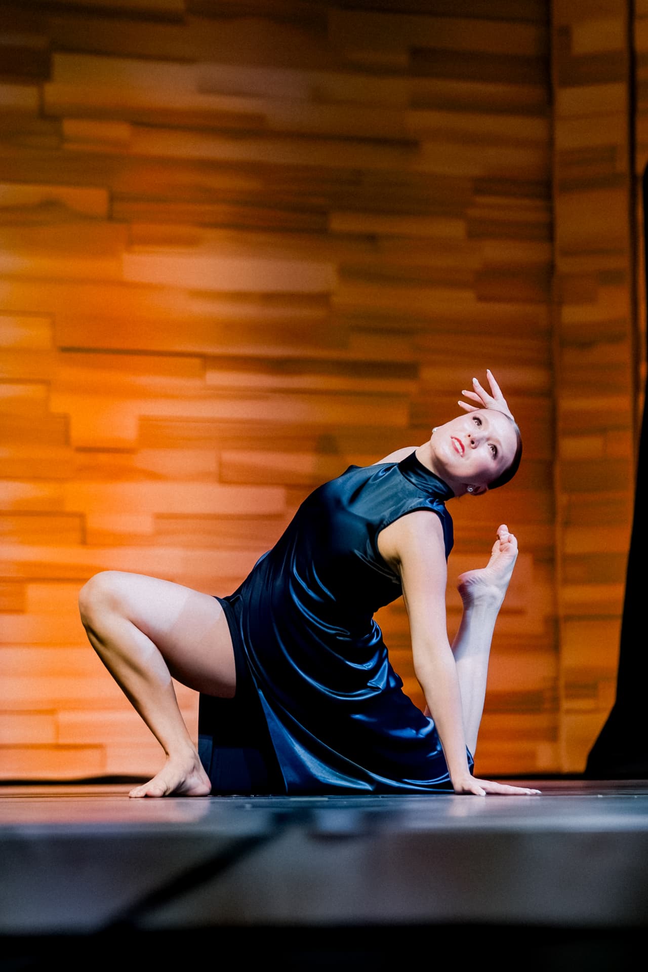 Solo dancer in blue costume on stage