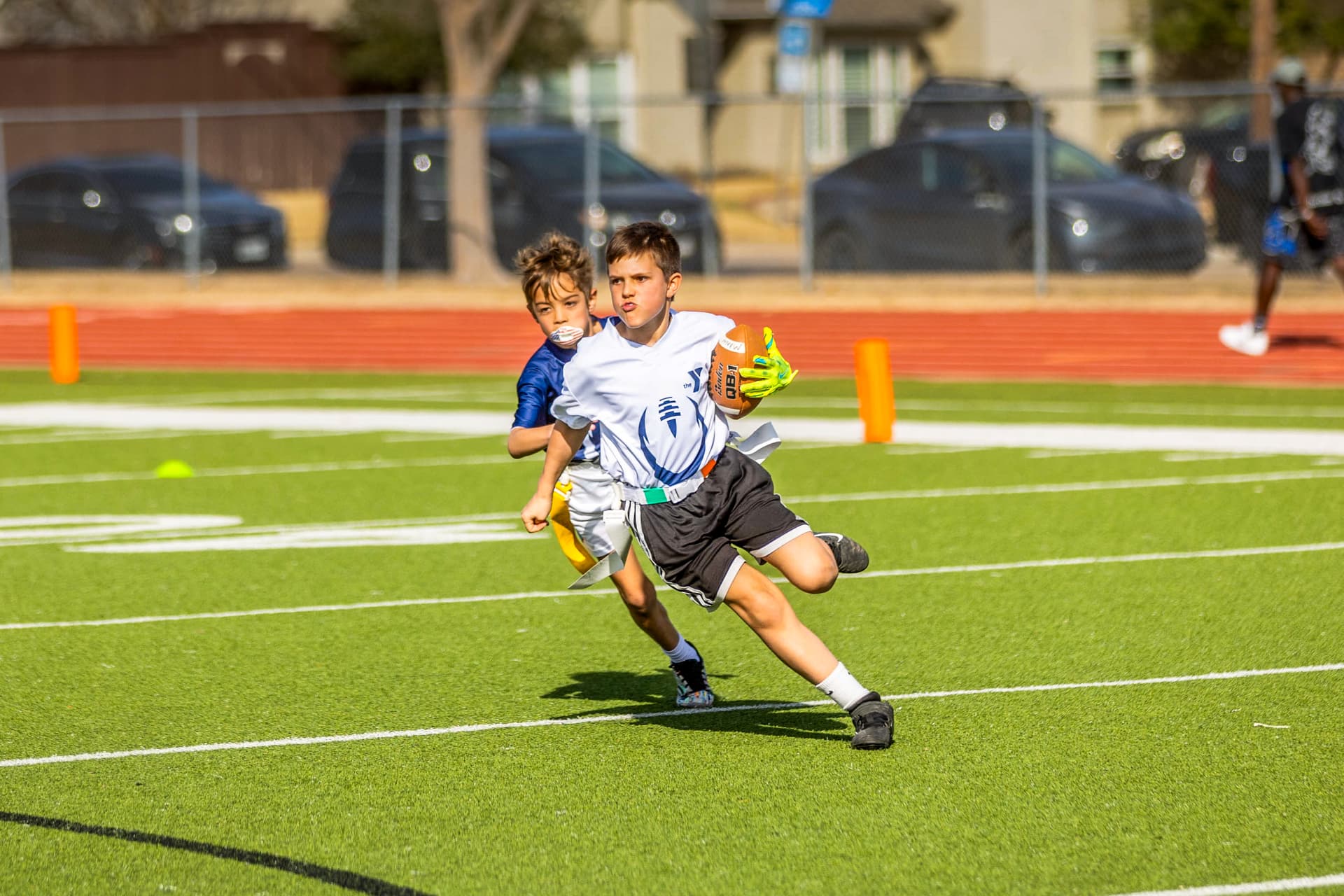 Flag football player cutting past a defender