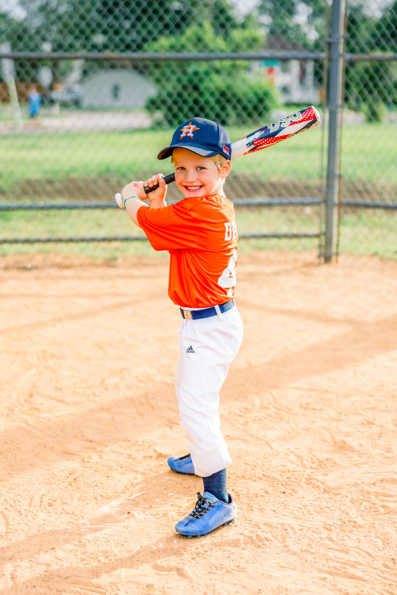 Young Astros player posing with a bat